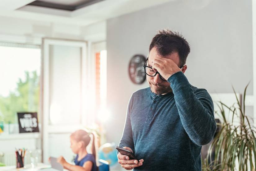 man looking at phone