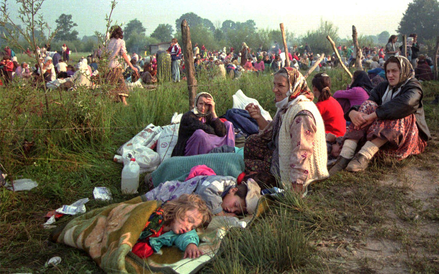 Refugees from Srebrenica gather outside the U.N. base at Tuzla airport.