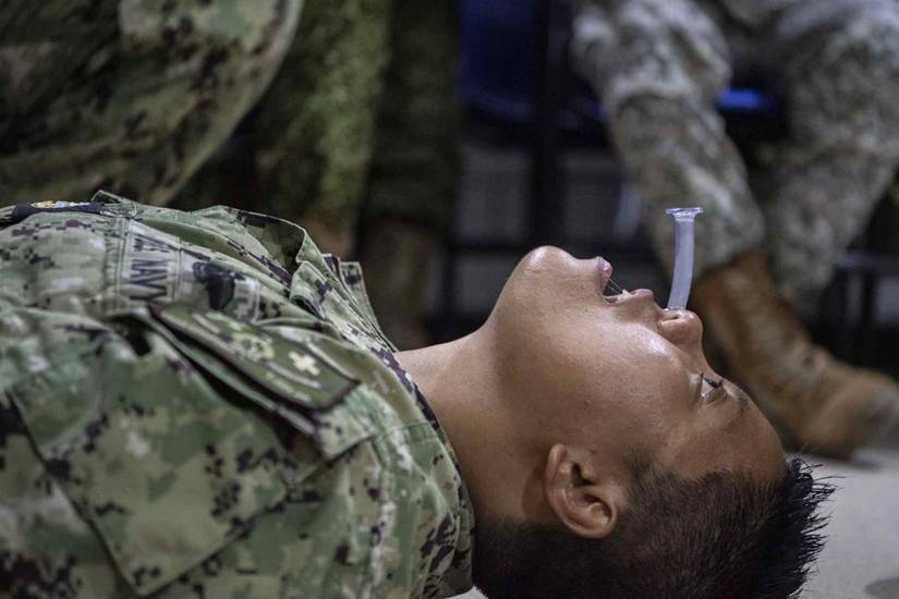 Navy Inhaler This Week’s Top Military Photos: Can You Hear Me Now and a Corpsman ...
