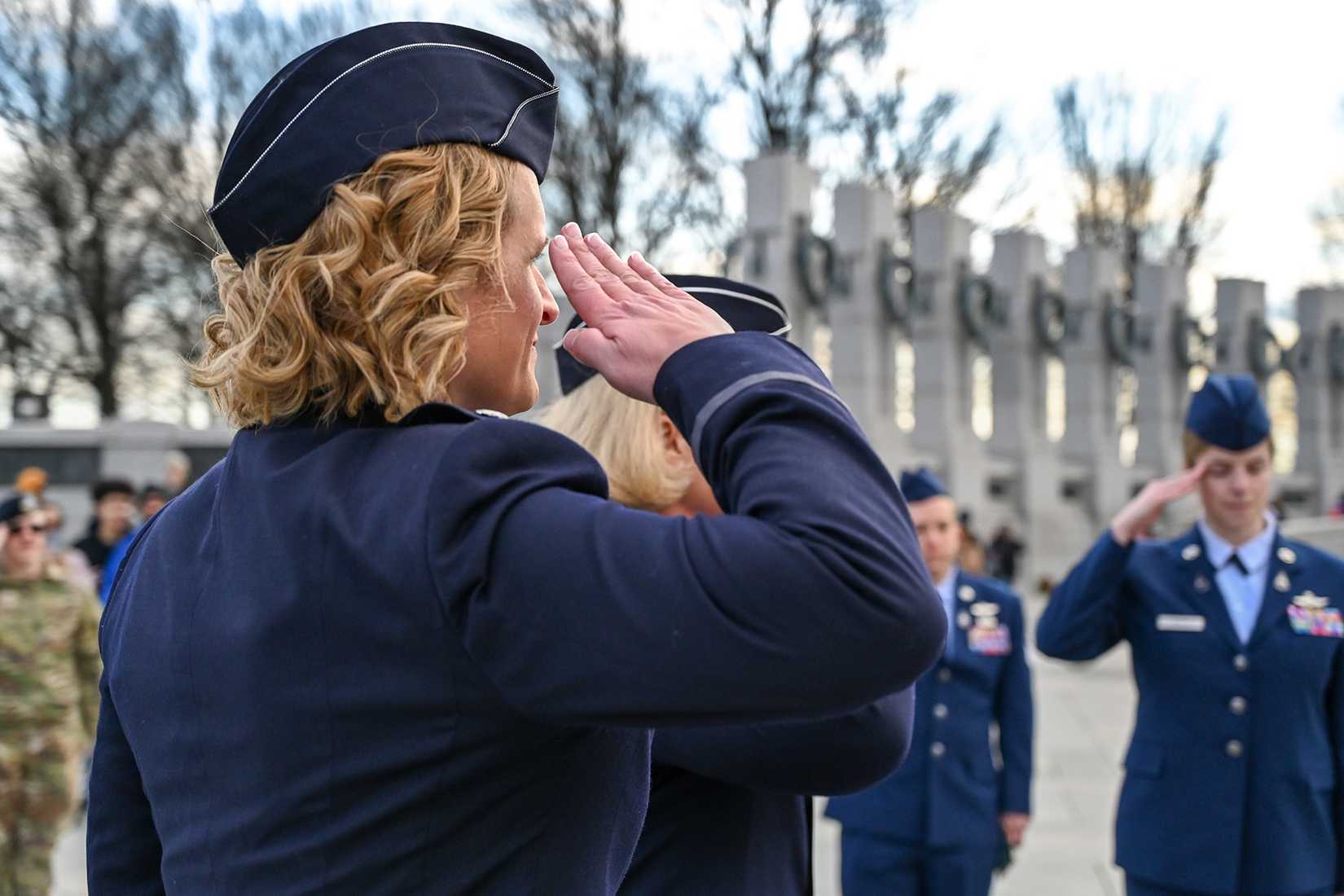 Col. Bree Fram salutes a flag at her promotion ceremony from lieutenant colonel that took place in December 2023 at the World War II Memorial in Washington, D.C. 