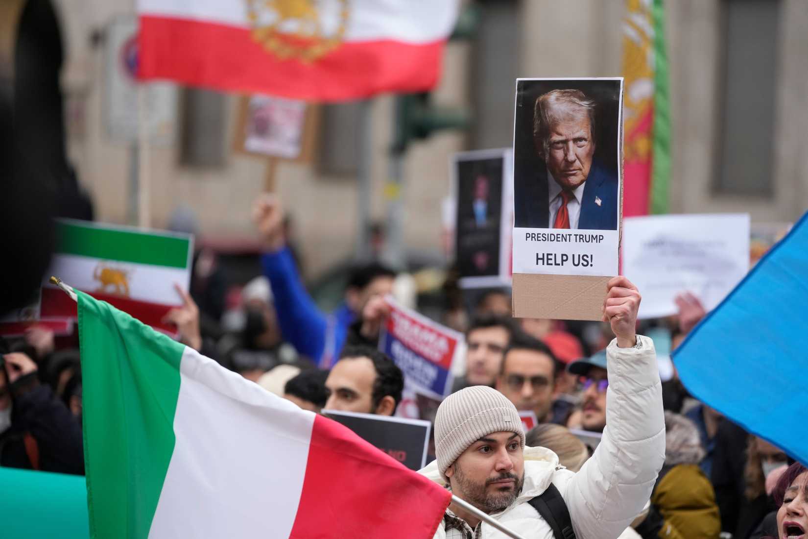 Protesters participate in a demonstration supporting protesters in Iran, in front of the US Consulate, Milan, Italy, Tuesday, Jan. 13, 2026. (AP Photo/Luca Bruno)