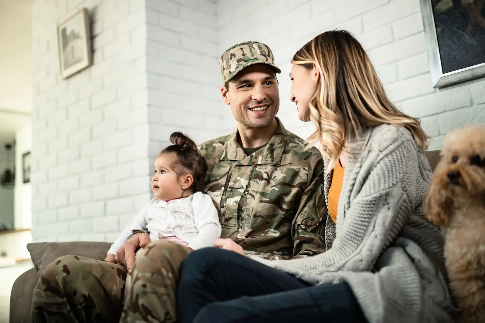 military member holding child