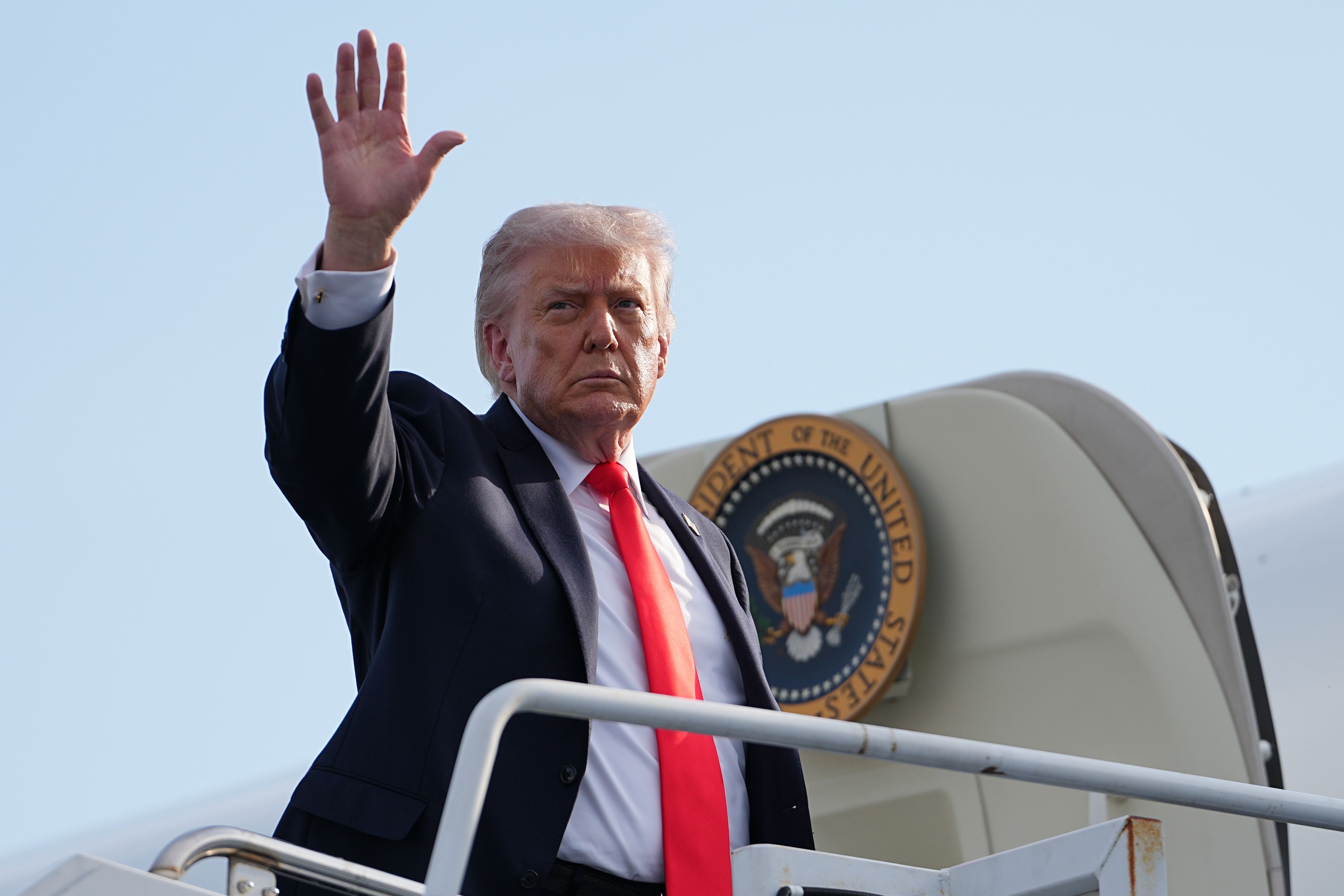AP Trump waves from Air Force One