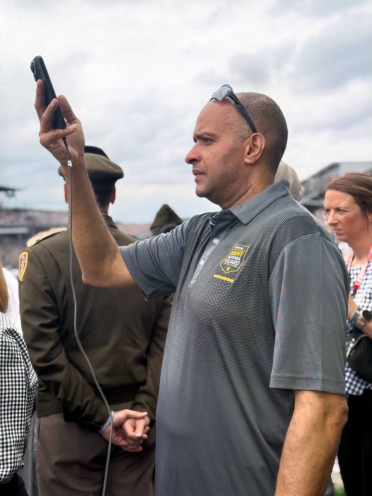 Unidentified Indiana National Guardsman watches military flyover at start of Indy 500 (Derricke Dennis).