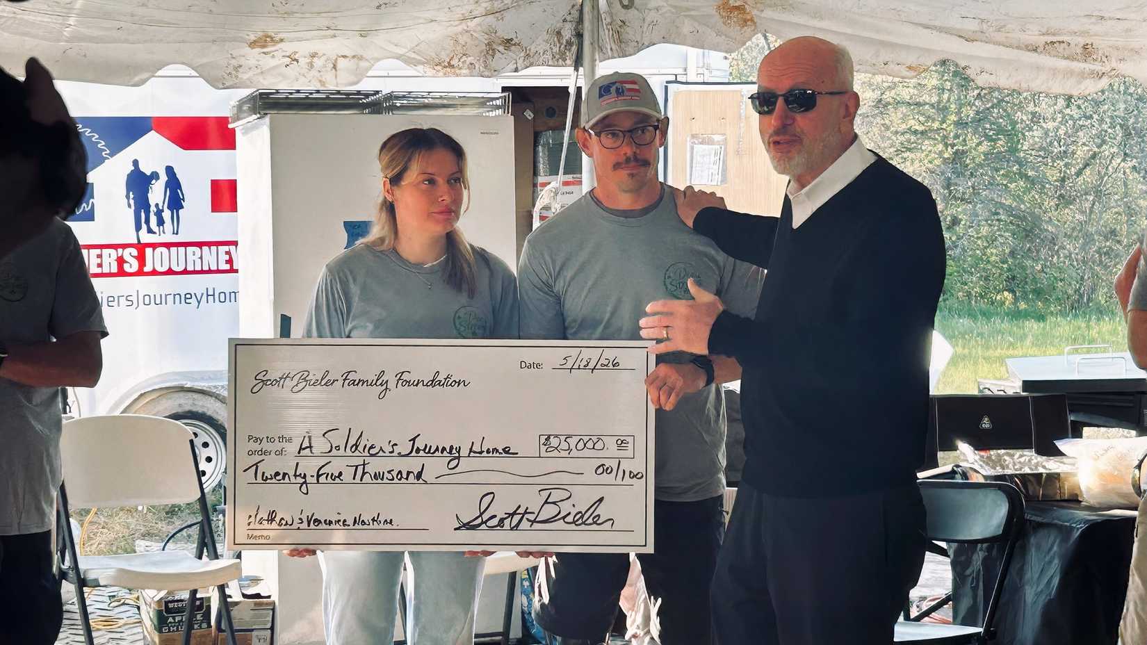 Scott Bieler of West Herr Automotive Group presents donation for Kalwicki home project (ASJH).