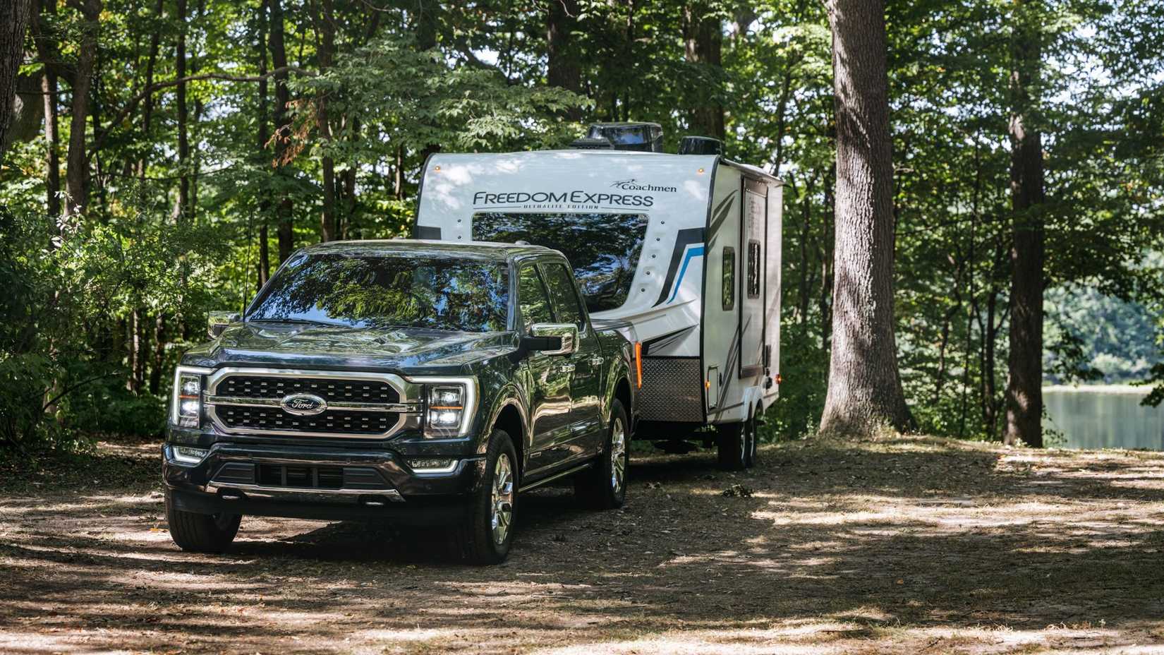 2025 Ford F150 Gray Front View Towing a Caravan