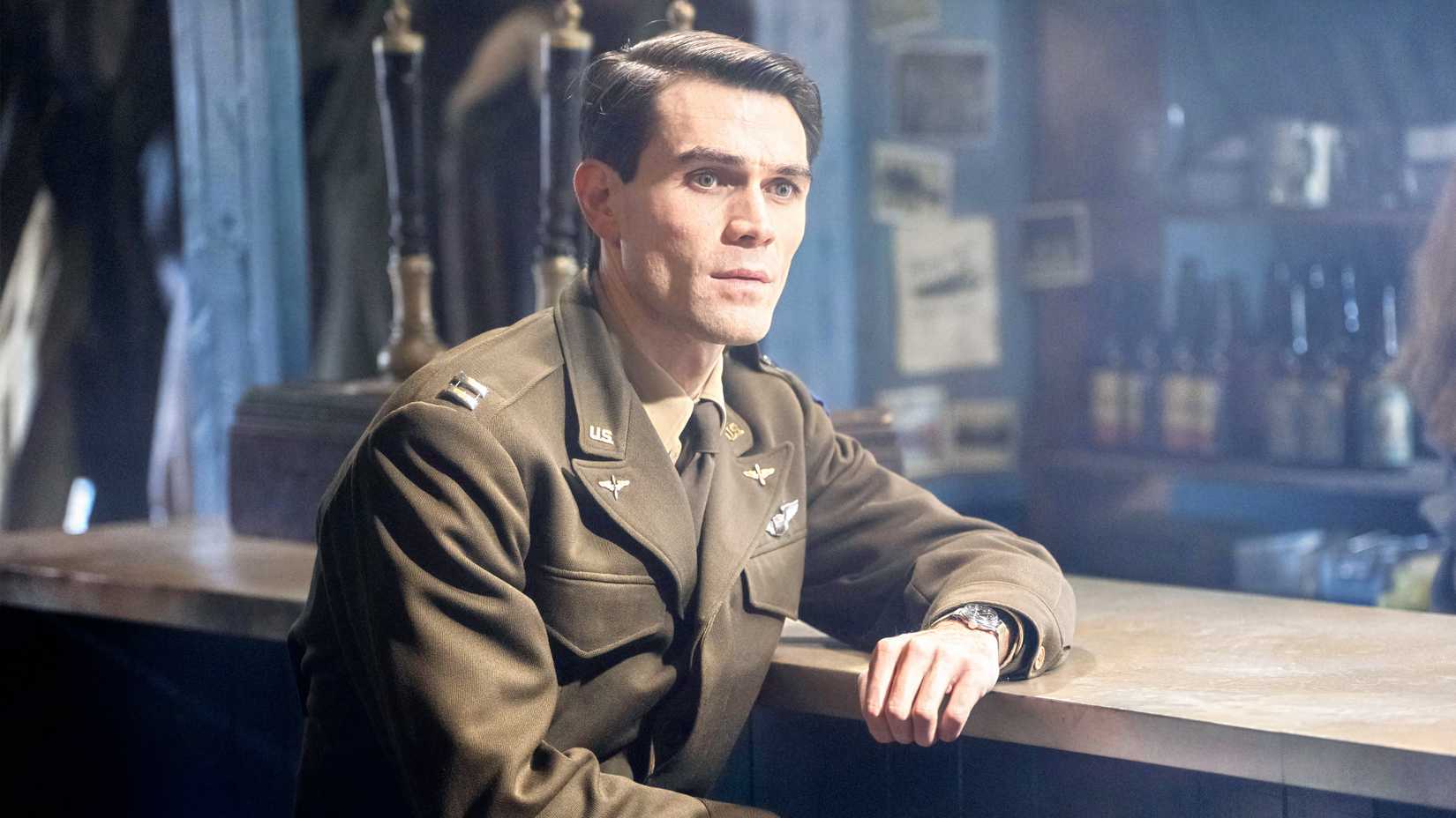 KJ Apa portrays Jimmy Stewart in uniform at a bar in a scene from JIMMY.