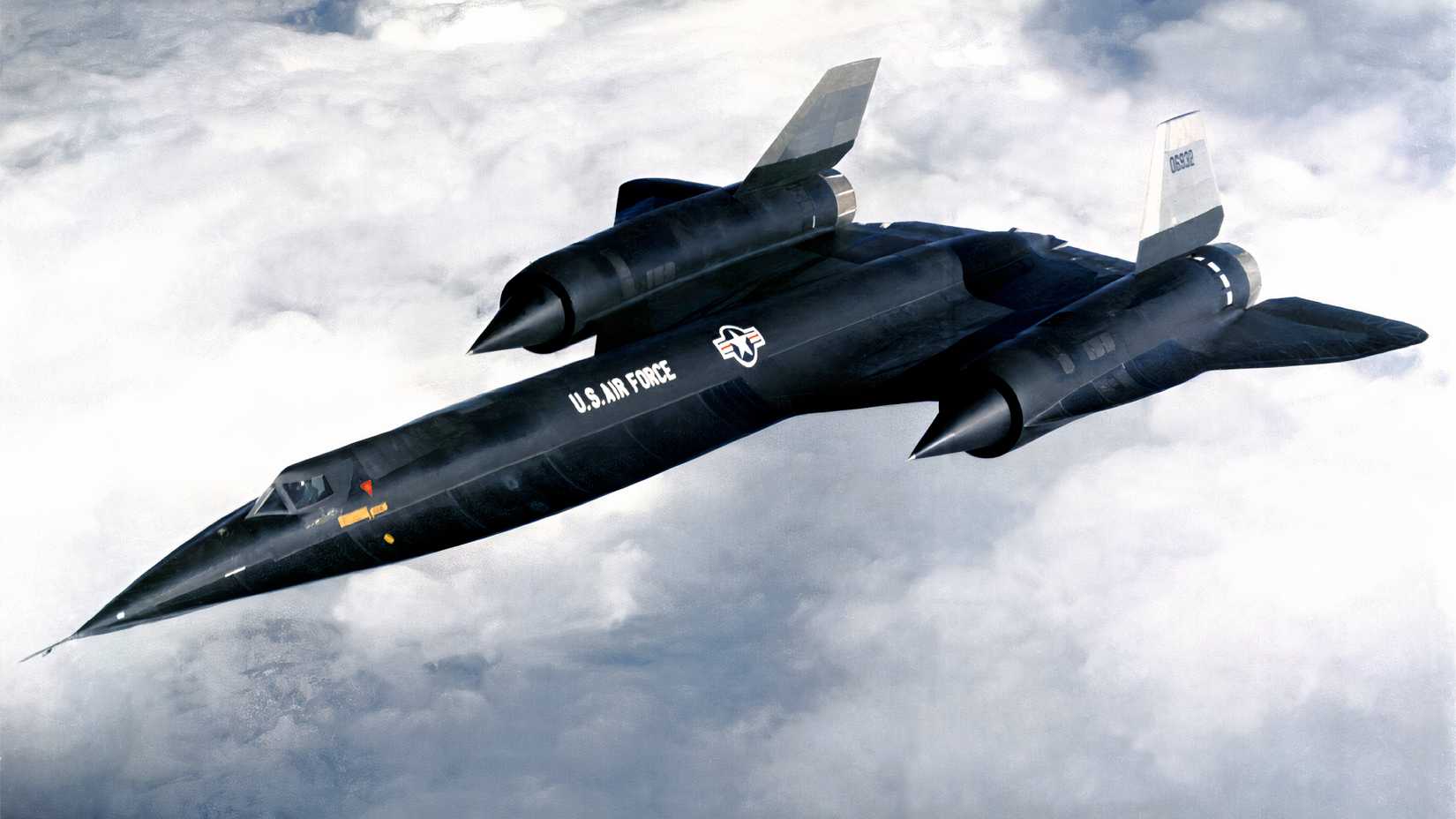 A Lockheed A-12 reconnaissance aircraft flies above clouds during a 1960s test or operational flight.