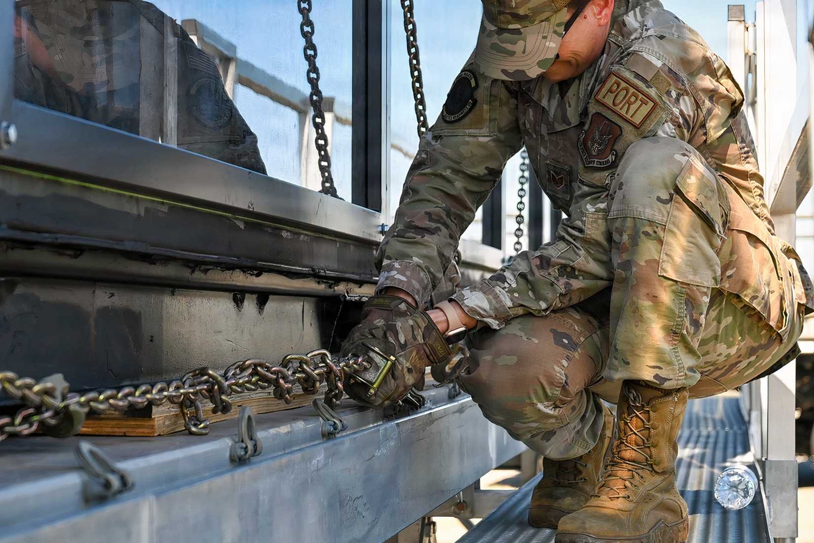 An Air Force airman secures equipment during preparations to transport a containerized nuclear power reactor at March Air Reserve Base, California.
