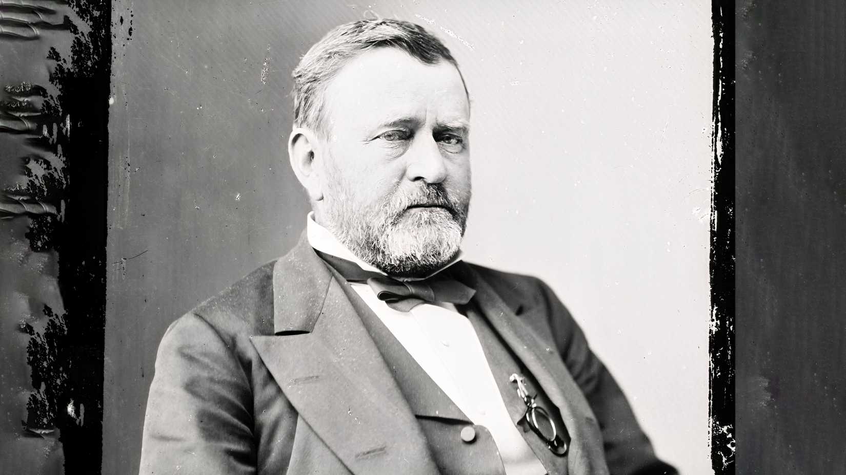 A black-and-white portrait of Ulysses S. Grant wearing a suit and bow tie.