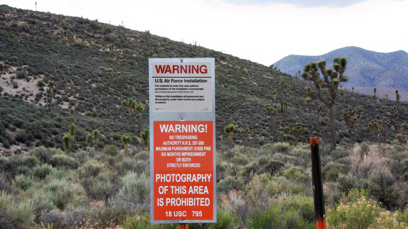 A warning sign near Area 51 states that entry is forbidden without permission from the installation commander.