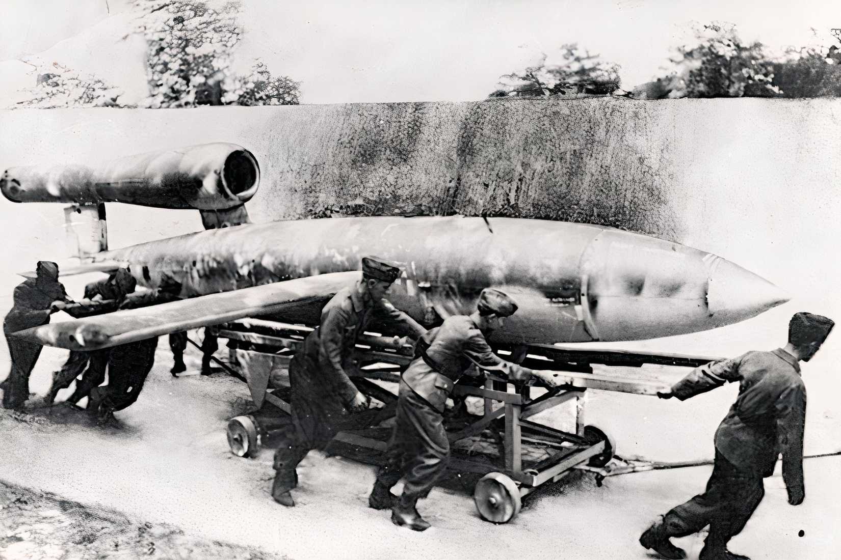 German soldiers move a V-1 flying bomb toward its launch position in 1944.