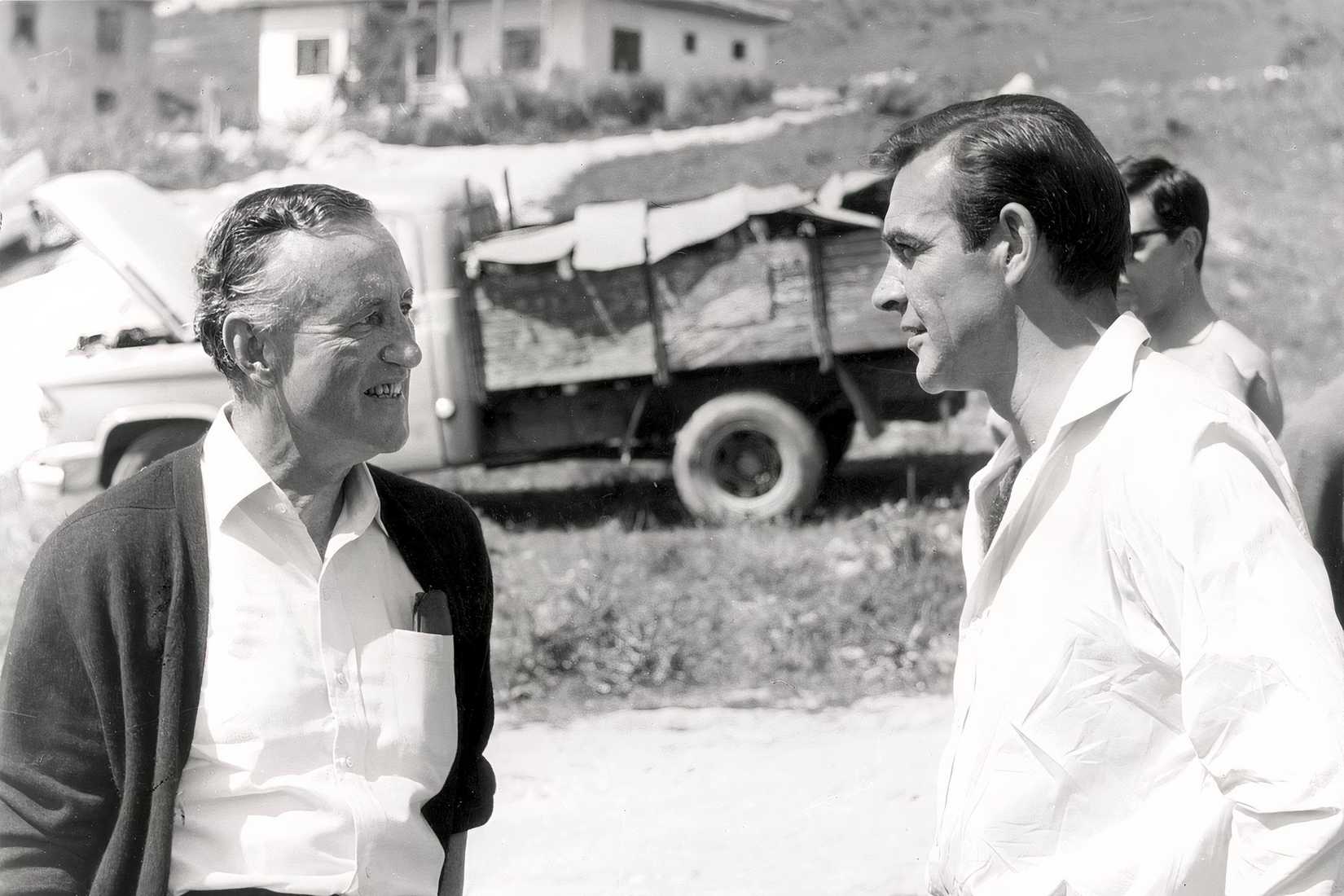 Ian Fleming speaks with a James Bond actor on the set of From Russia With Love.