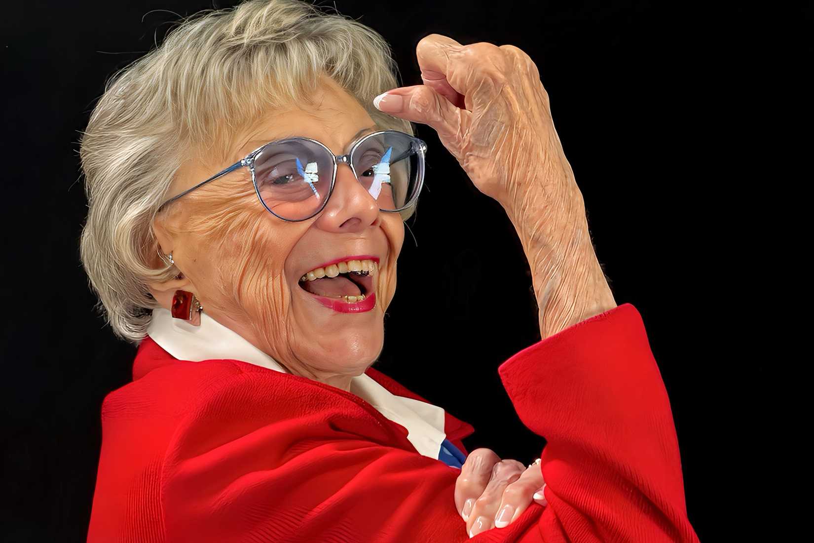 Roberta "Randy" Tidmore, a 104-year-old World War II Marine veteran and former Rosie the Riveter, poses with the iconic Rosie flexed-arm gesture.