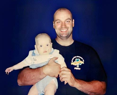Stephen Siller Sr. holding his infant son shortly before he was killed in the 9/11 attacks. (Tunnel to Towers Foundation).