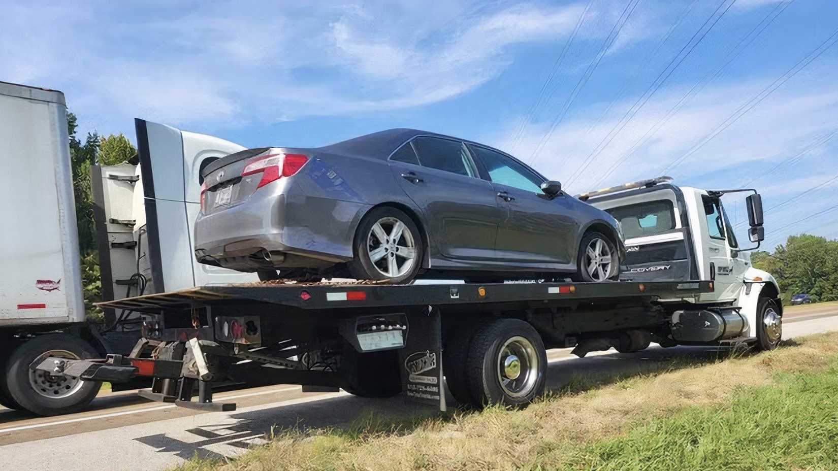 Toyota Camry on a Flatbed Tow Truck