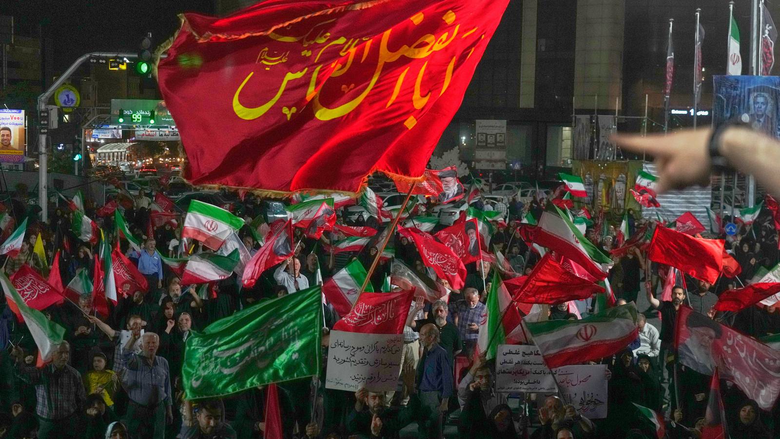 Pro-government demonstrators gather at a square in Tehran.