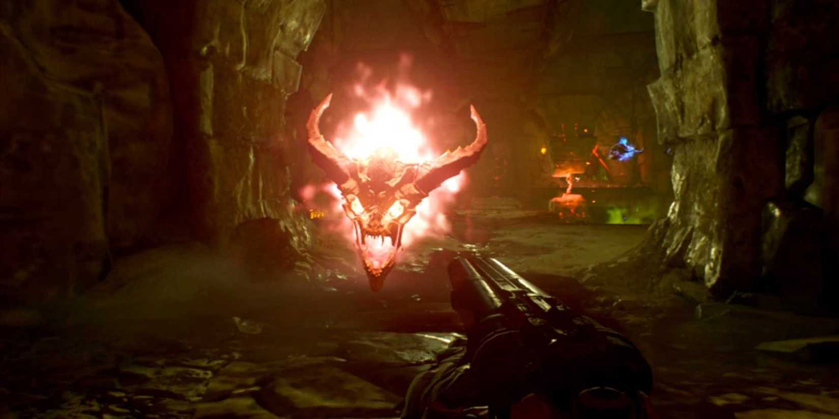 A flaming, horned demon head floats menacingly toward the player in a hellish cavern in Doom (2016) on Switch