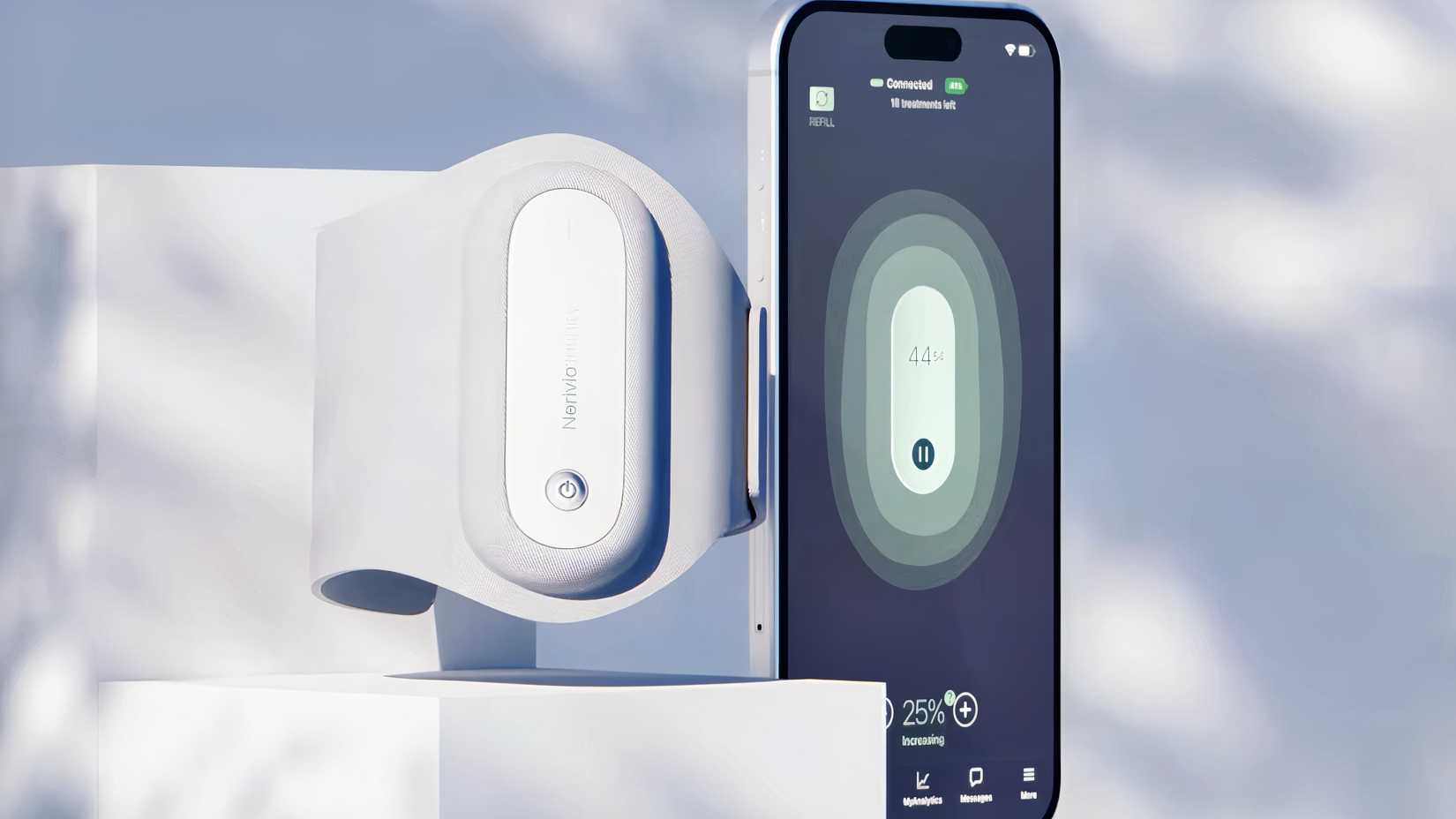 The Nerivio migraine wearable sits beside a smartphone displaying the app used to control treatment intensity.