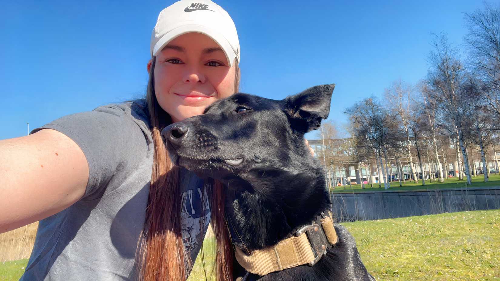Rebecca Anderson takes a selfie with military working dog Boss while stationed overseas.