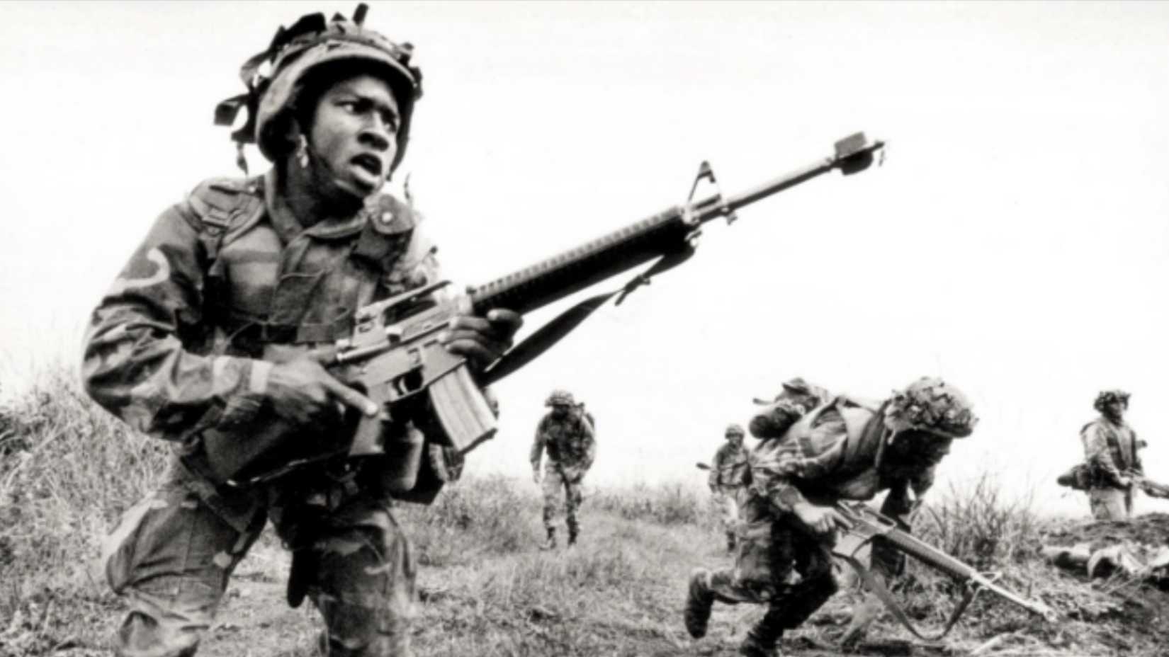 African American U.S. soldiers move during combat operations in Vietnam in 1969
