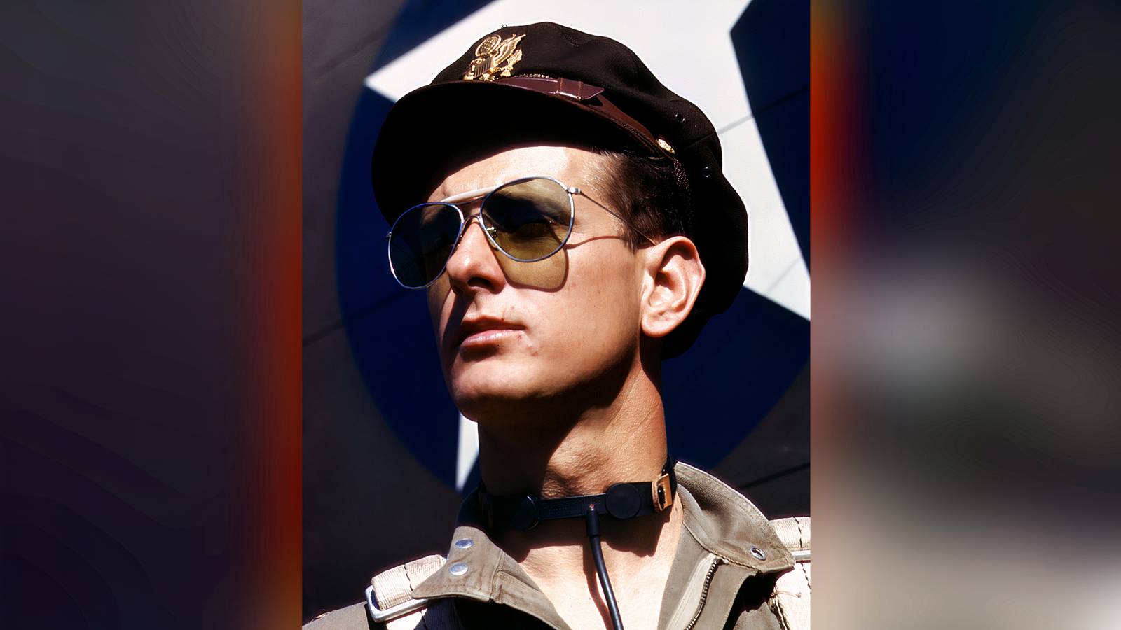 Army test pilot F.W. Hunter wears aviator sunglasses and a flight cap at a California aircraft plant in 1942.