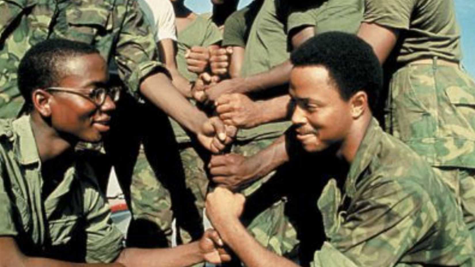  Black American soldiers perform the %22dap%22 greeting in Vietnam, 1969. Photograph by Wallace Terry : Wallace Terry Archives
