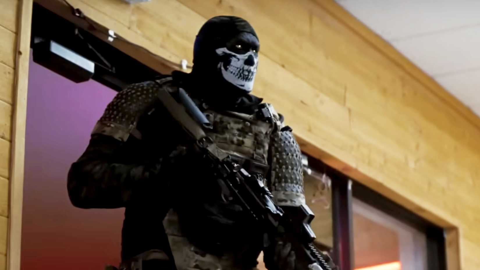 A heavily armed soldier wearing a skull-patterned mask stands inside a building in "Onslaught."