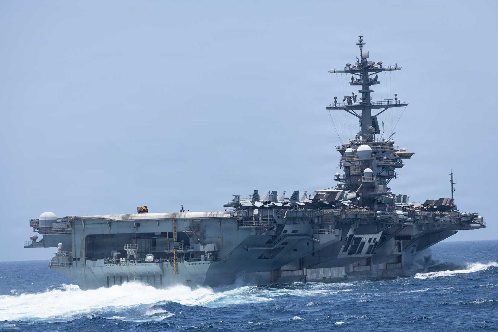 USS_Abraham_Lincoln_Conducts_a_Replenishment-at-Sea
