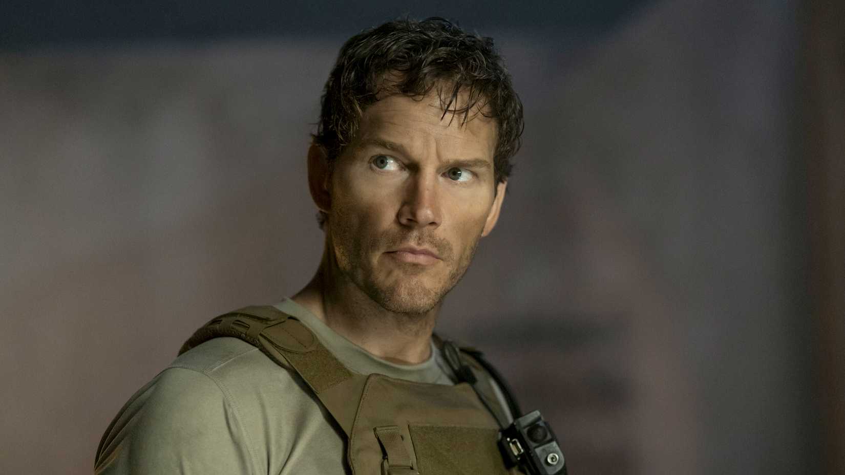 Chris Pratt as Navy SEAL James Reece wearing tactical gear and looking off-camera in The Terminal List Season 2.