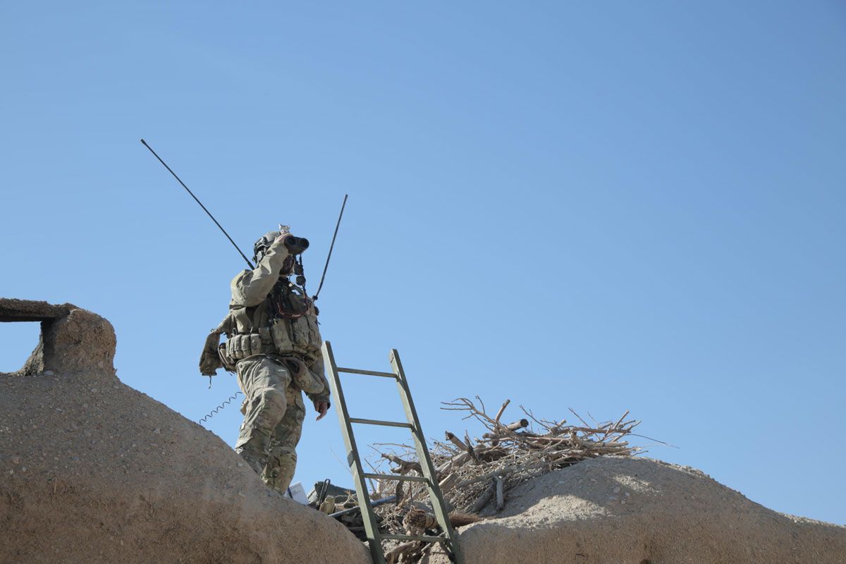 A combat controller, deployed with a U.S. Army Special Forces team in Afghanistan, searches for targets to provide close air support during an engagement with insurgents. (U.S. Air Force photo)