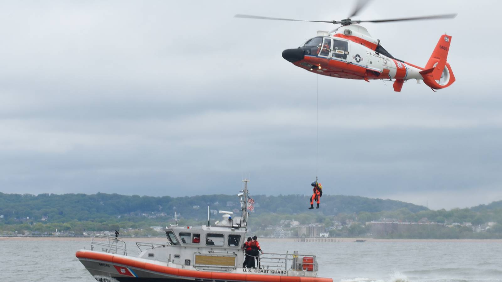 Coast Guard Helicopter Rescues 3 Commercial Fishermen