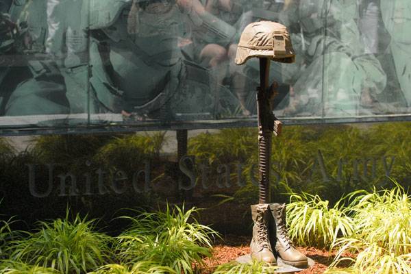 Planned Monument in Memorial Causes Controversy Over Prominence of Gun