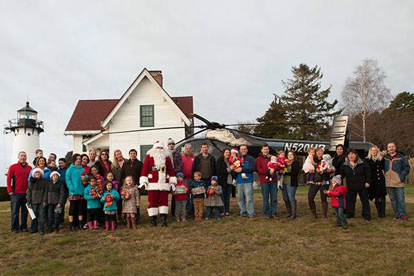 Flying Santa Delivers Holiday Cheer, Gifts to Coast Guard Families